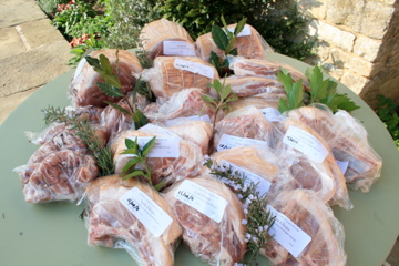 A half pig butchered, packed and labelled ready for the freezer
